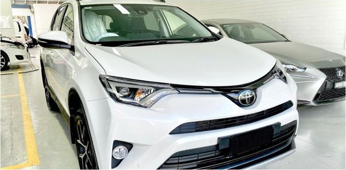 The same white Toyota RAV4 after repair at CHICHO Panel Beating, front end rebuilt, resprayed and polished.